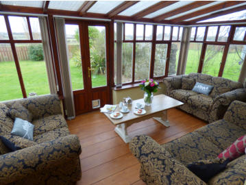 Conservatory and large garden.